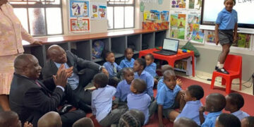 President Cyril Ramaphosa sits with Grade R pupils while Lwandle Nxumalo