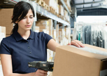 Envato Elements - Warehouse workers using barcode scanner on box in distribution warehouse - TechNewsToday.co.za